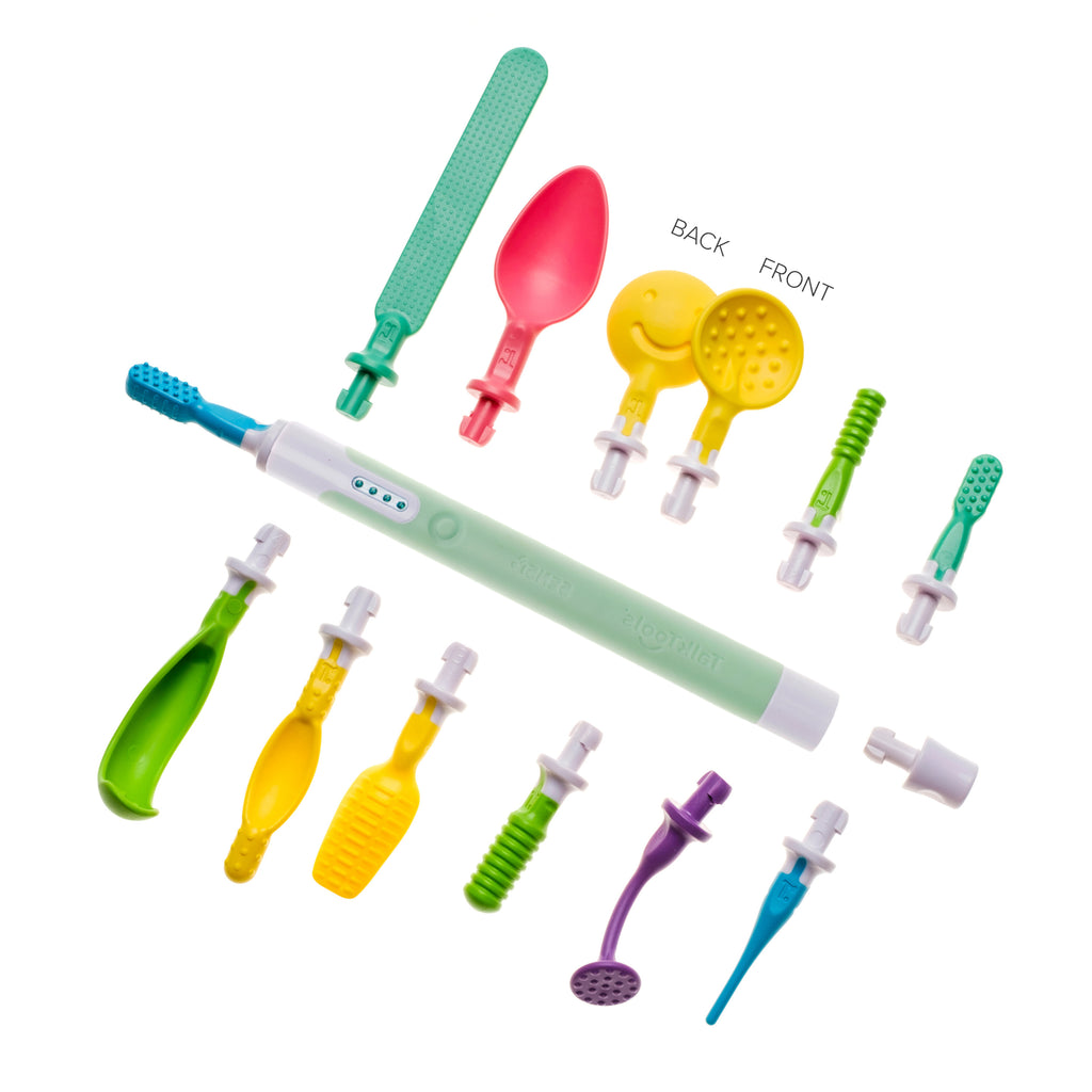 One light green TalkTools Sensi tool surrounded by twelve colorful plastic sensory tips in various shapes and sizes.